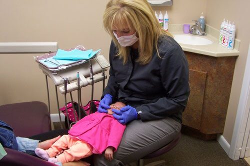 doctor treating small child
